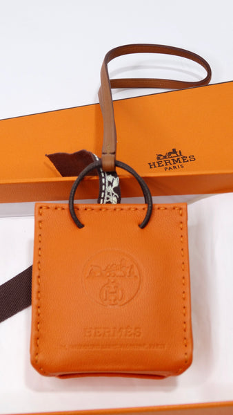 HERMES Orange Shopping Bag Charm Feu/ Gold *New - Timeless Luxuries