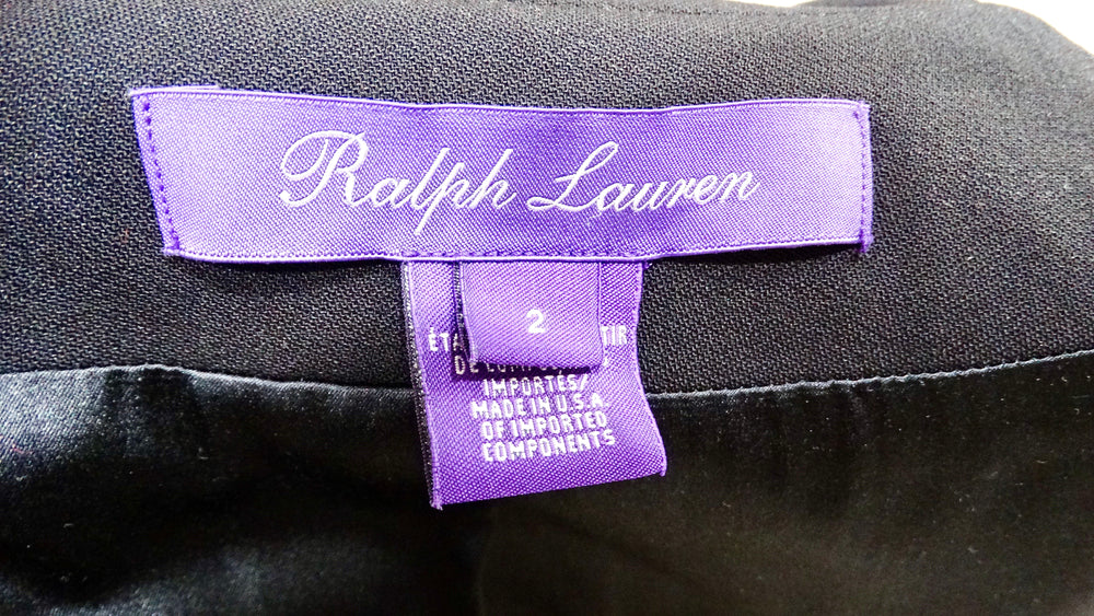 Ralph Lauren label on a black garment with a purple tag.