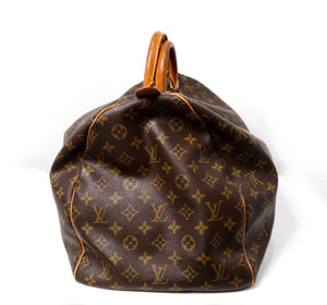 The Louis Vuitton Keepall 55 Monogram Coated Canvas Duffel Bag