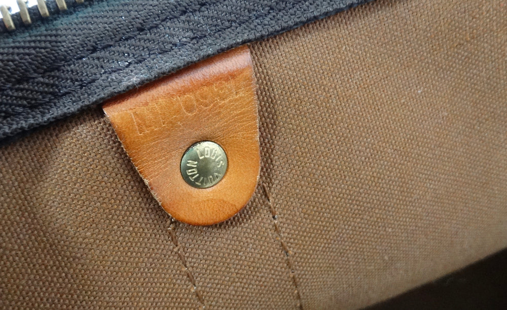 The Louis Vuitton Keepall 55 Monogram Coated Canvas Duffel Bag