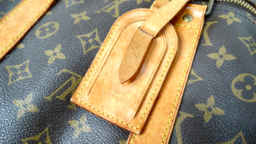 The Louis Vuitton Keepall 55 Monogram Coated Canvas Duffel Bag