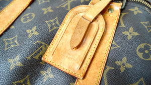 The Louis Vuitton Keepall 55 Monogram Coated Canvas Duffel Bag