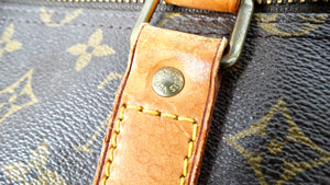 The Louis Vuitton Keepall 55 Monogram Coated Canvas Duffel Bag