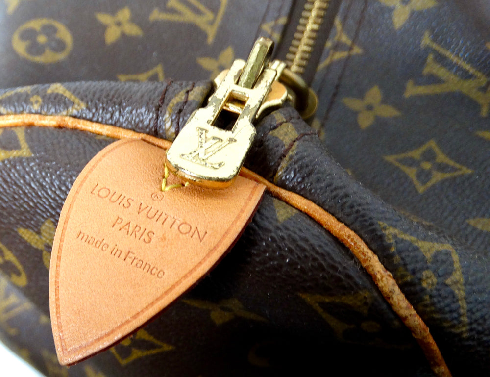 The Louis Vuitton Keepall 55 Monogram Coated Canvas Duffel Bag