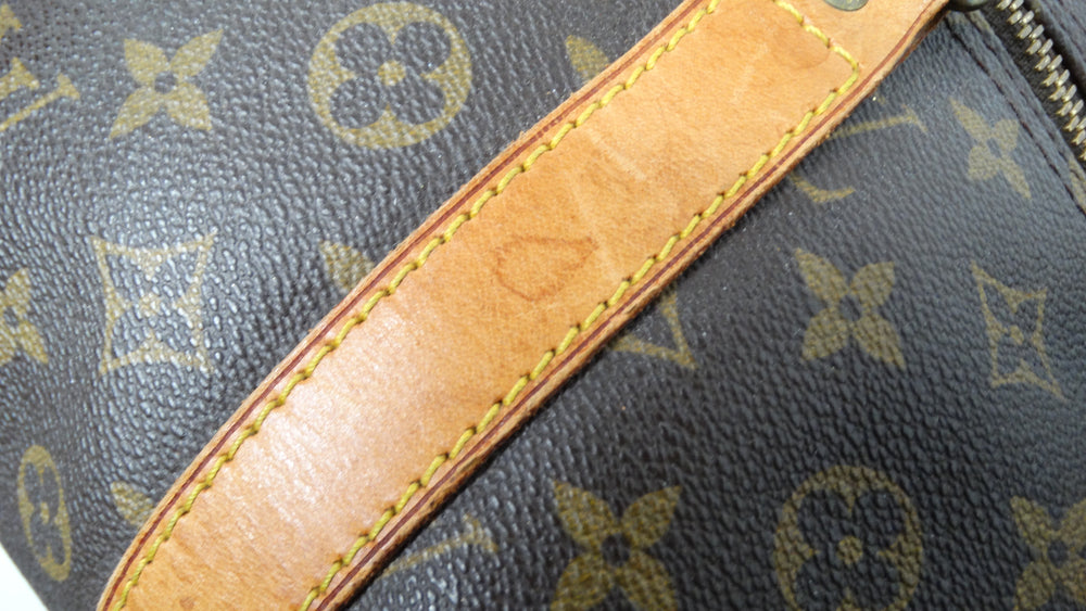 The Louis Vuitton Keepall 55 Monogram Coated Canvas Duffel Bag