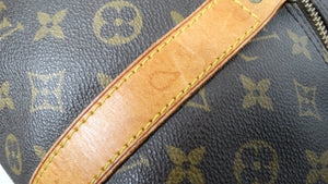 The Louis Vuitton Keepall 55 Monogram Coated Canvas Duffel Bag