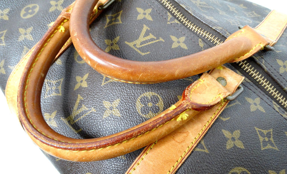 The Louis Vuitton Keepall 55 Monogram Coated Canvas Duffel Bag