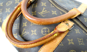 The Louis Vuitton Keepall 55 Monogram Coated Canvas Duffel Bag
