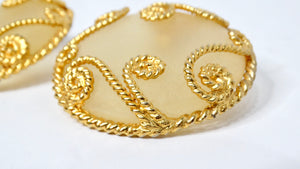 1980s Escada Large Matte Resin Clip-On Earrings With Ornate Gold Tone Detailing