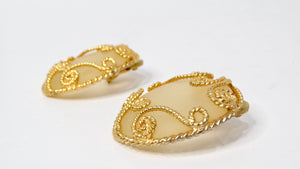 1980s Escada Large Matte Resin Clip-On Earrings With Ornate Gold Tone Detailing
