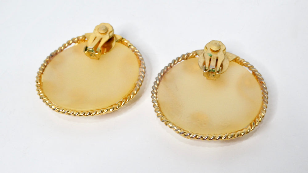 1980s Escada Large Matte Resin Clip-On Earrings With Ornate Gold Tone Detailing