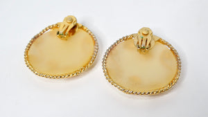 1980s Escada Large Matte Resin Clip-On Earrings With Ornate Gold Tone Detailing