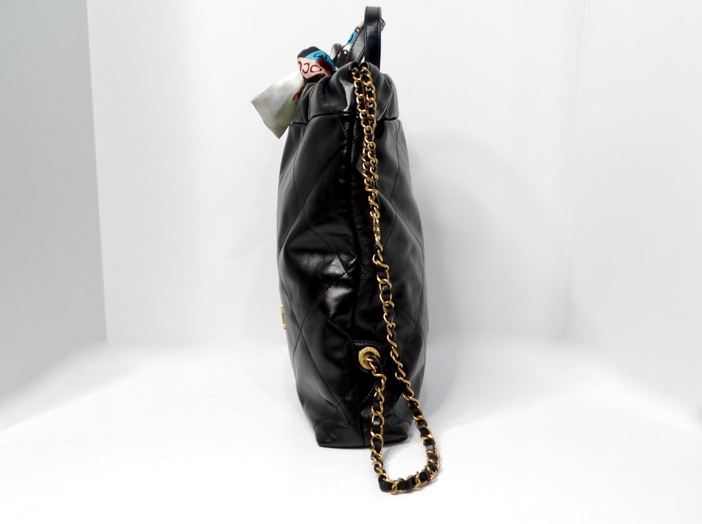 Chanel 22 Black Shiny Calfskin Backpack With Gold-Tone Hardware & Twill