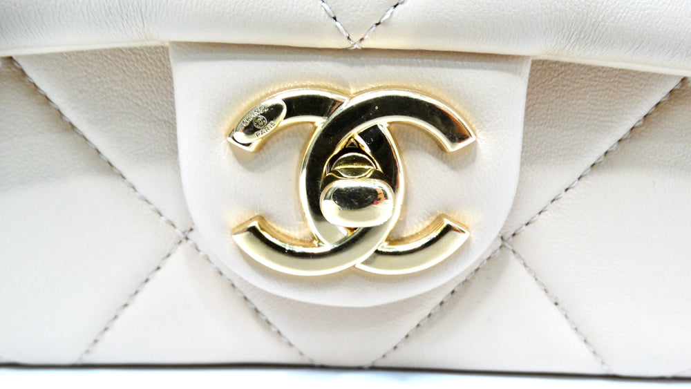 Chanel Beige Quilted Lambskin Interlocking CC Chain Flap Bag 2024