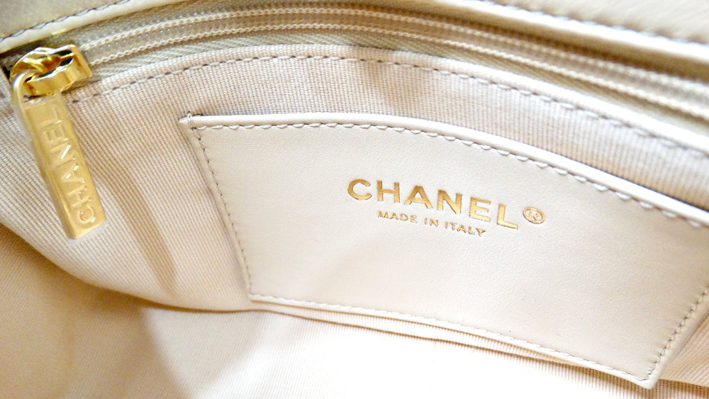 Chanel Beige Quilted Lambskin Interlocking CC Chain Flap Bag 2024
