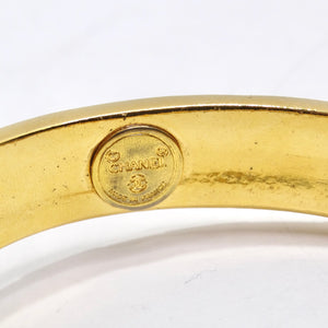 Chanel 1980s Gold Tone Logo Bangle