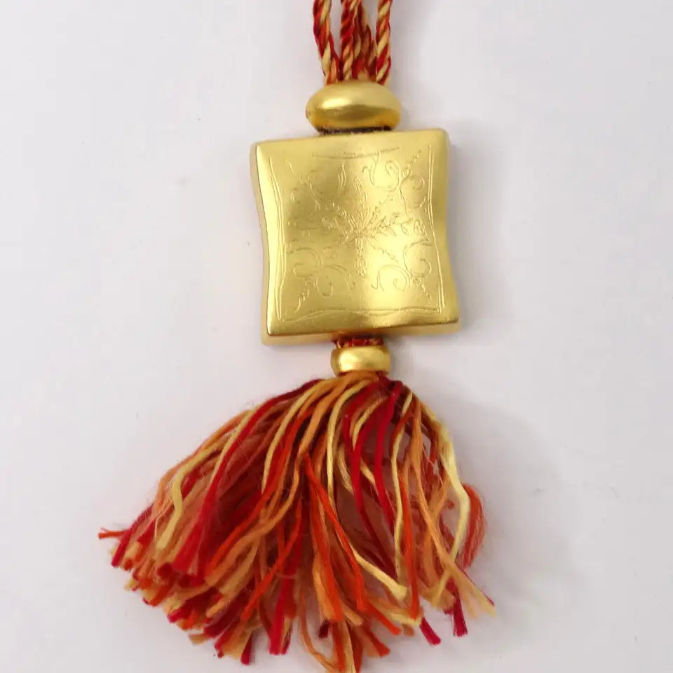 Hermes Gold Tone Pendent on Silk Yarn Chord Necklace