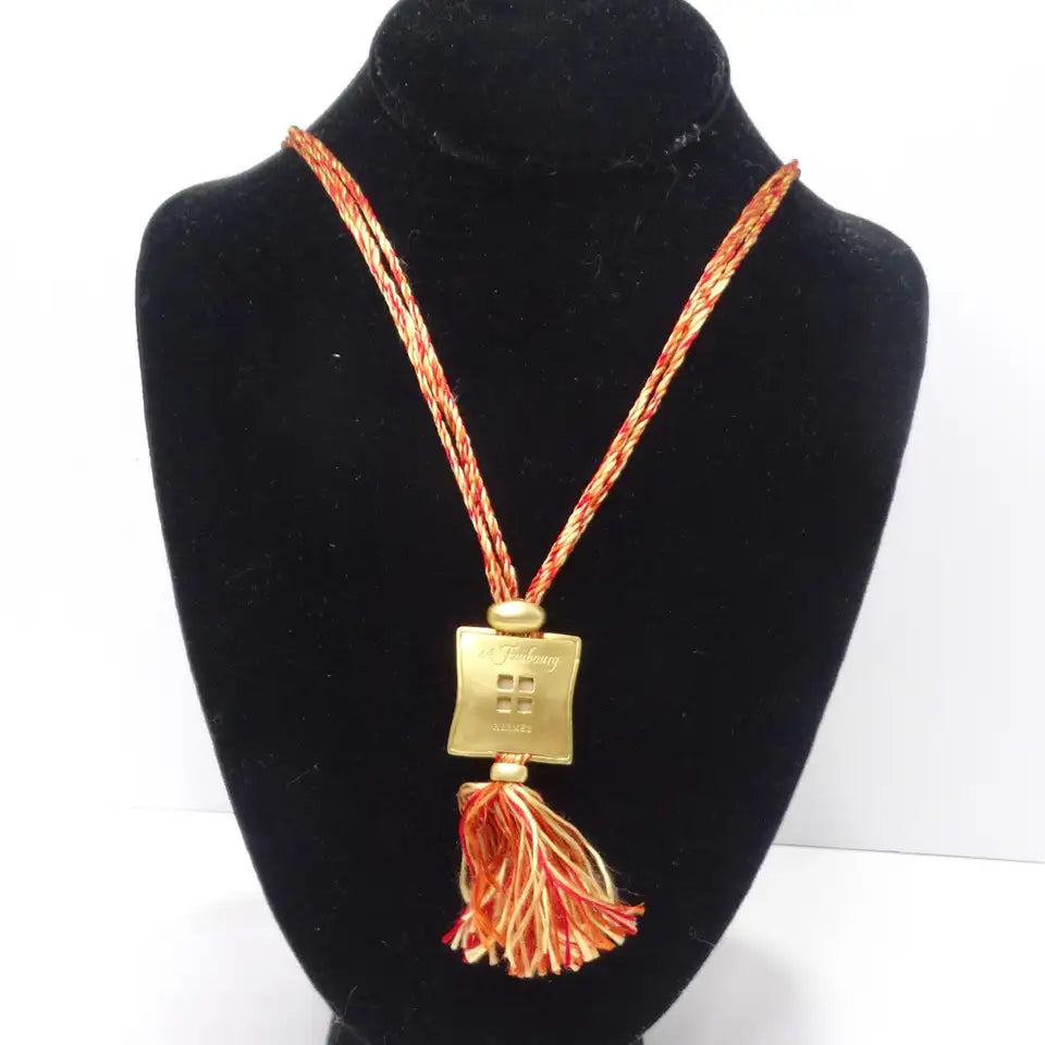 Hermes Gold Tone Pendent on Silk Yarn Chord Necklace