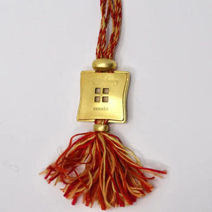 Hermes Gold Tone Pendent on Silk Yarn Chord Necklace