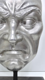 Metallic 'Angry Face' Sculpture