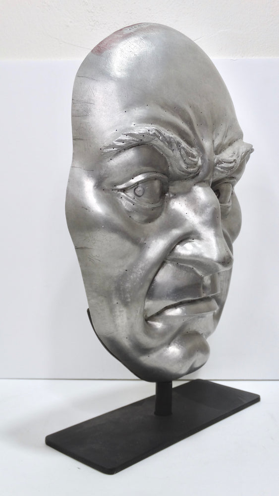 Metallic 'Angry Face' Sculpture