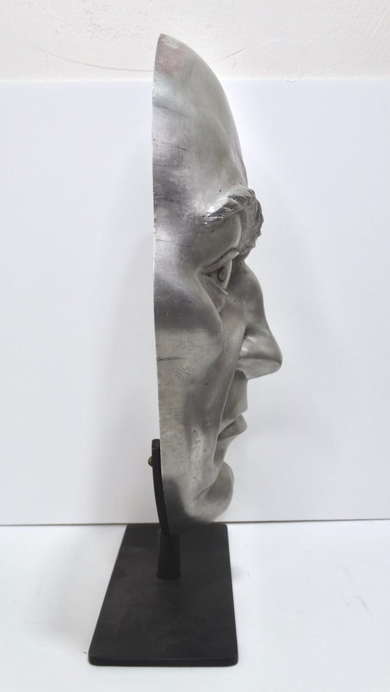 Metallic 'Angry Face' Sculpture