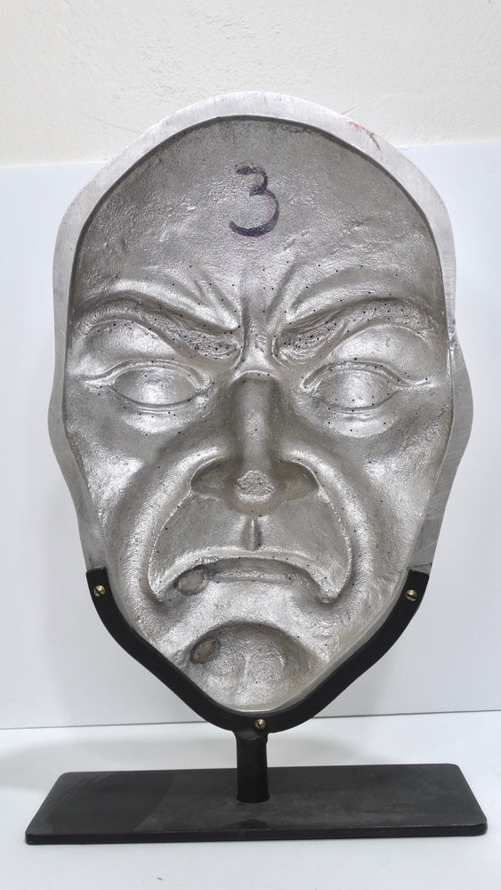 Metallic 'Angry Face' Sculpture